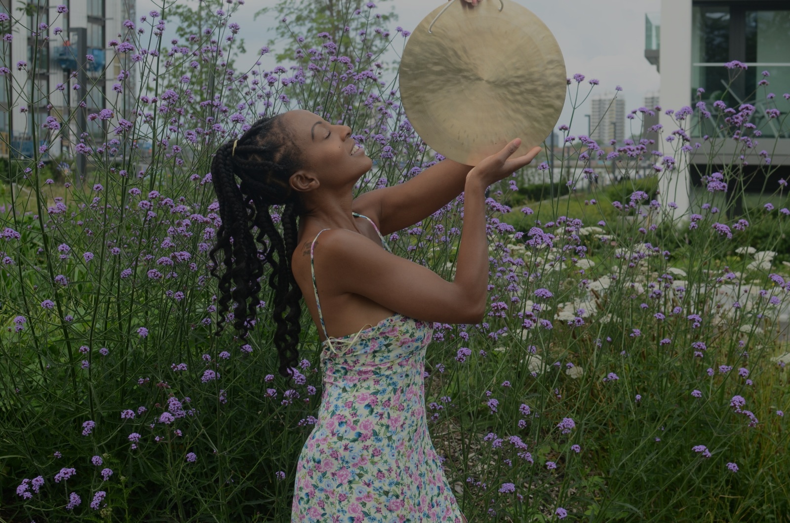 Mary Bello holding gong